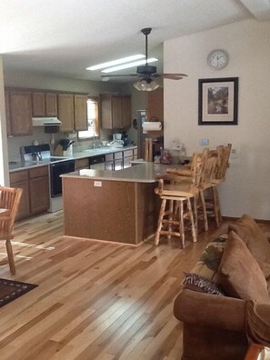 Well equipped kitchen with quartz counter tops
