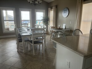 Small side table and island counter allows for 7 additional seats for dining in 