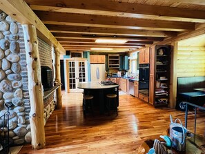 Kitchen  with soapstone counters, cherry wood floors, and walk-in food closet. 