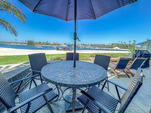 Seating for 4-6 around table, two lounge chairs and two bar chairs