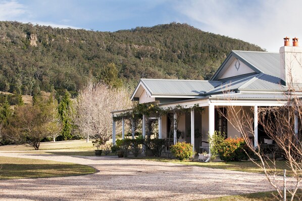 A gorgeous county home nestled between mountains in a fully enclosed valley.