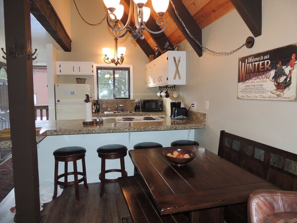 Dining Room and Kitchen with granite countertops. Seating for 10.