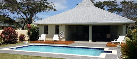 Rear of Villa showing family friendly pool and teak decks for sunbathing