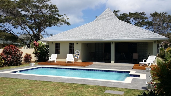 Rear of Villa showing family friendly pool and teak decks for sunbathing