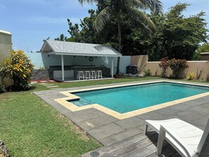 New expansive outdoor BBQ and bar area to relax and enjoy the pool and sunsets.
