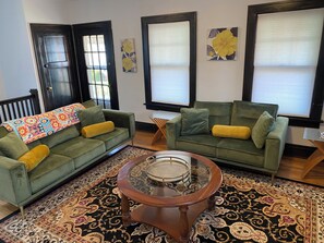 Living room 1 located in the second floor apartment.