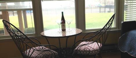 Sunroom table , What a way to watch the lake, the pool and the people!