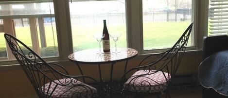 Sunroom table , What a way to watch the lake, the pool and the people!  
