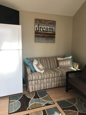 Full size refrigerator and love seat couch