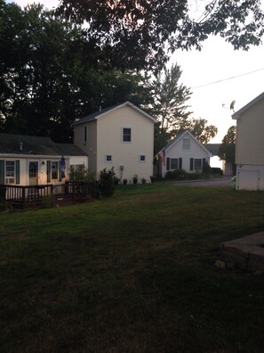 Showing distance from deck to the beach behind the 3rd house is the water