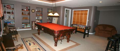 Game Room, TV
Pool Table,  XBox, FoosBall, Bar, Games, Puzzles, Books
Chair bed