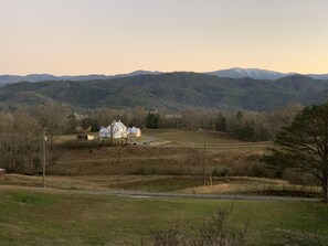 Front view  looking off deck- watch the cows while sipping coffee.