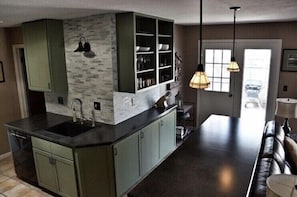 Kitchen area with Keurig coffee machine and full stock of coffees and teas.