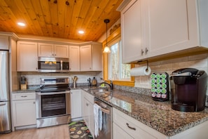 Kitchen with granite counters and stainless steel appliances