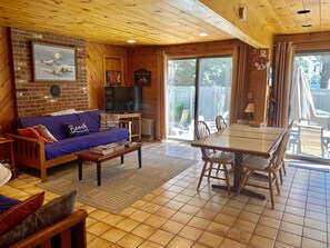 First floor open concept living room and dining room looking out to yard