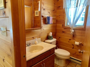 First floor half bathroom to the right as you enter the beach house