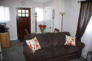 Another side of living room with queen size sofa hide a bed
