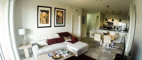 Cozy Living and dinning room. Authentic prints of the artist Luciano Martins