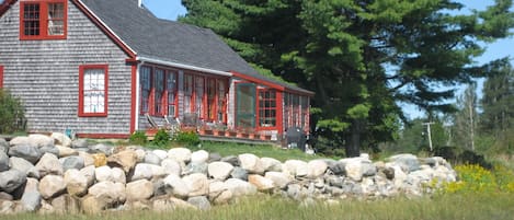 The deck and back of the cottage from the water.