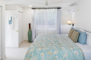 Indulge in the beauty and serenity of a pristine bedroom, adorned with a luxurious King-sized bed