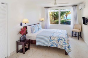 Experience the grandeur of the great room, where the living area boasts breathtaking views of both the beach and the garden. Enjoy the stunning vistas from the bedroom as well, adding to the allure of your surroundings