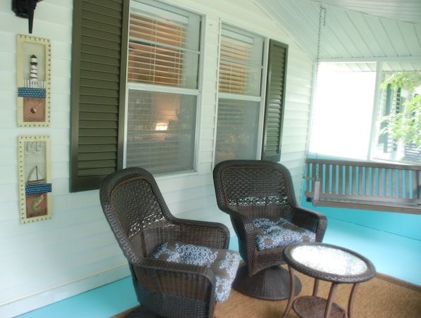 Welcome to Sandy Hook. Prepare to relax on the nicely appointed screened porch.