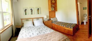 master bedroom, daybed and ensuite bathroom with tub/shower