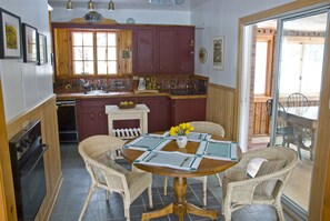 lovely, functional kitchen with slate floors and cooking equipment