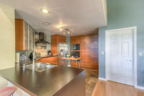 Kitchen complete with dishwasher, dishes, silverware, cookware, appliances,