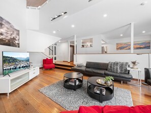 Spacious lower lounge area with smart tv and sonos.