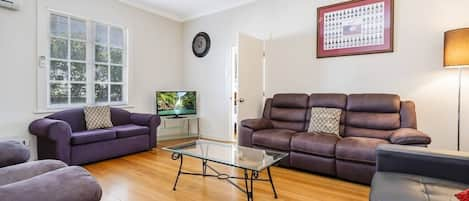 lounge room and entry to third bedroom