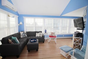 Living room with sectional sofa and flat screen TV