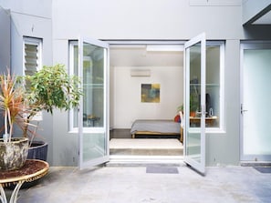 View from outside the unit looking through the big double doors to the back wall
