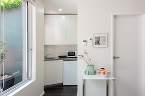 View of kitchenette to the left upon entering the unit