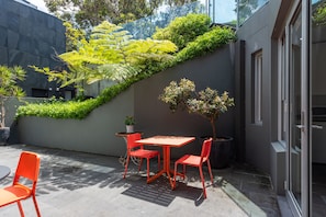 View of the shared patio with your table outside your unit