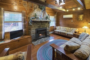 Dramatic 2 story Stone Fireplace and Skylights in Living room