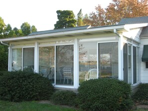 The 3 season sunroom is a great place to eat dinner and enjoy the view.