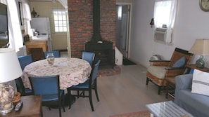 Dining area, showing  galley kitchen, electric fireplace & room air conditioner