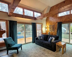 Light filled living room with a pull out sofa bed (Queen) & sliders to the deck