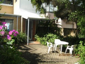 Courtyard and main entrance, other entrance from garage.