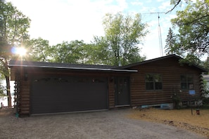 Front of house.  There is now a concrete driveway with stone parking slab area.