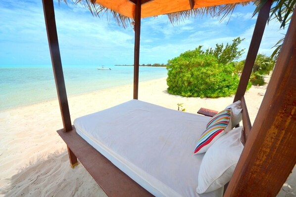 Spend the day on the day-bed and drift away by the cool tropical breeze