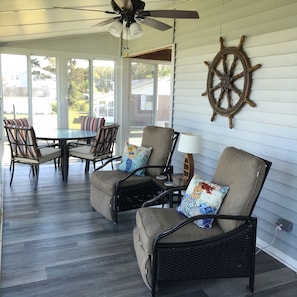 Enjoy gentle breezes and tranquil views from the 380 Sq Ft enclosed porch.
