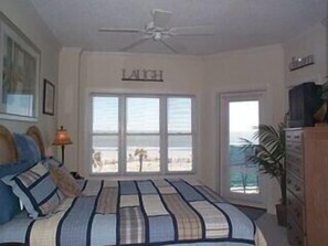 Ocean/beach views through master bedroom.  Comforter has been updated since pic.