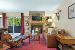 Comfy living room with 40" TV, wood burning fireplace and views of Vail Mountain