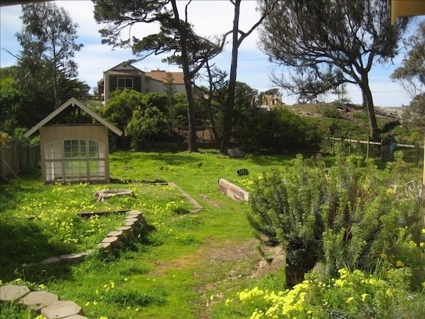Half an acre of grounds, with the ocean beyond