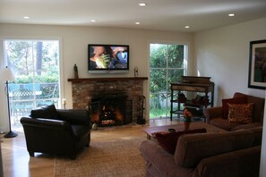 Living room with fireplace, flat-screen tv, sweet views