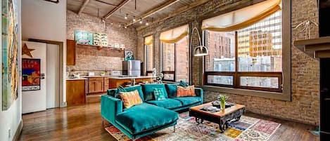 City Loft Penthouse w/ large living area, fireplace with views of Printers Alley