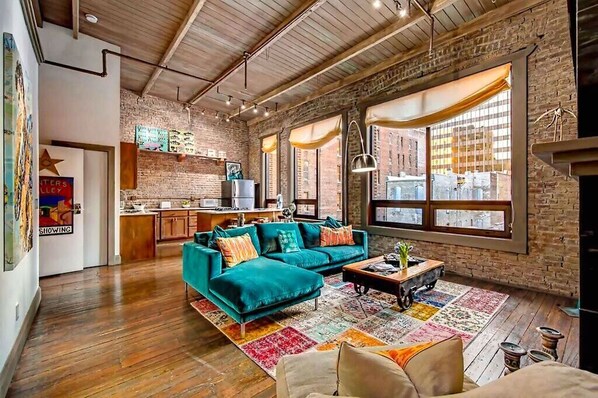 City Loft Penthouse w/ large living area, fireplace with views of Printers Alley