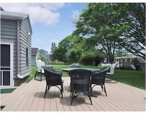 Patio area with table & chairs and large picnic table